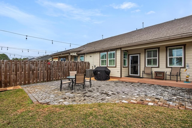 846 Cannon Ln, Destin, FL 32541 - back of house with a patio, a yard, roof with shingles, and fence