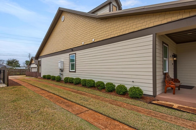 846 Cannon Ln, Destin, FL 32541 - view of side of home with a lawn and fence