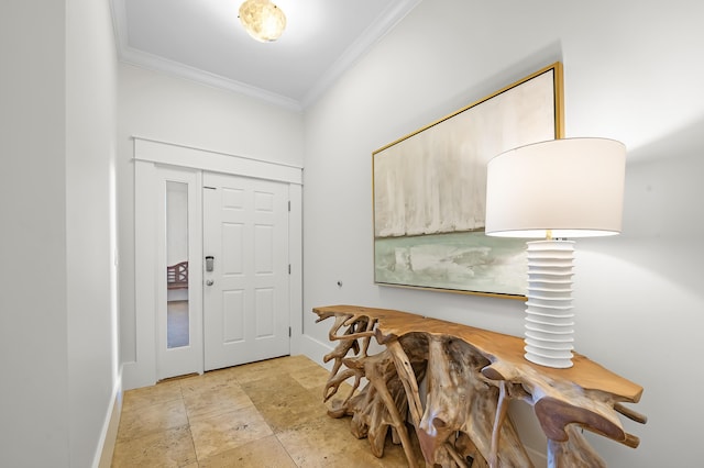 foyer entrance with stone finish floor and crown molding