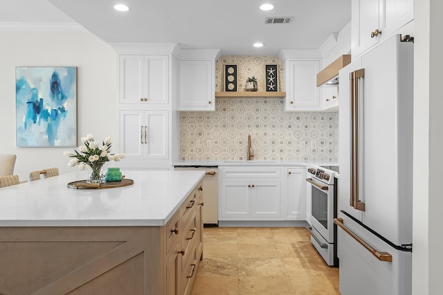 kitchen featuring white appliances, a sink, white cabinets, light countertops, and open shelves