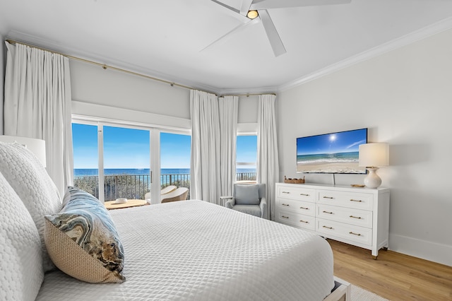 bedroom featuring light wood finished floors, baseboards, ceiling fan, access to exterior, and crown molding