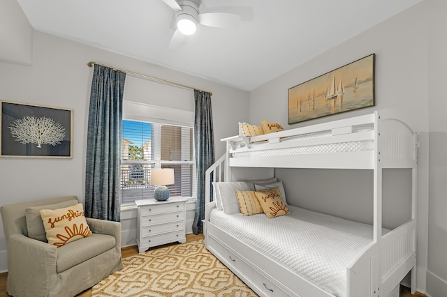 bedroom with light wood-style flooring and a ceiling fan