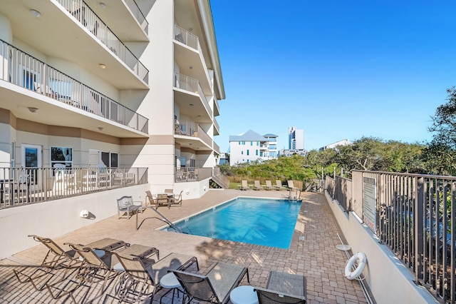 view of pool with fence