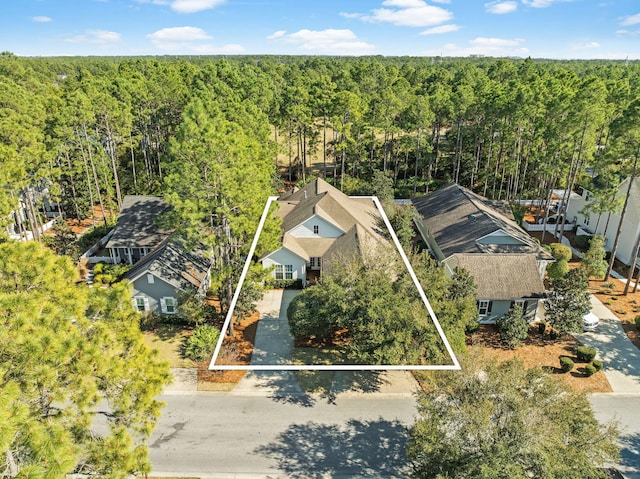 drone / aerial view with a view of trees