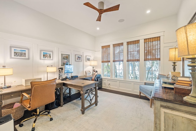 office area featuring ceiling fan, recessed lighting, and a decorative wall