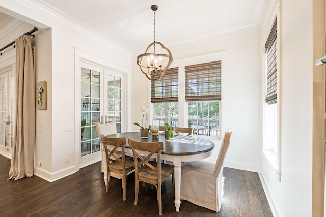 dining space featuring a chandelier, baseboards, dark wood finished floors, and crown molding