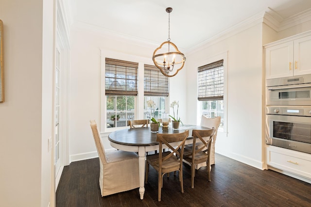 dining room with a chandelier, ornamental molding, dark wood finished floors, and baseboards