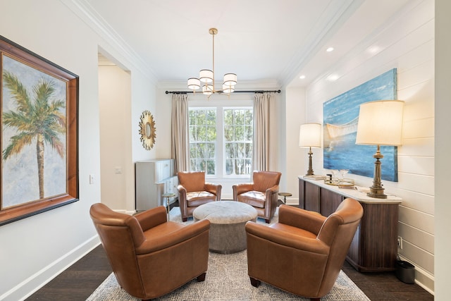 living area with recessed lighting, baseboards, ornamental molding, dark wood finished floors, and an inviting chandelier