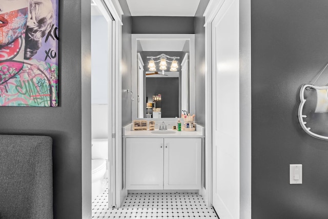 bathroom featuring vanity and toilet