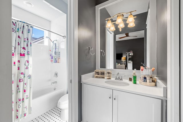 full bathroom with toilet, shower / bath combo, a ceiling fan, and vanity