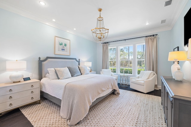 bedroom featuring visible vents, crown molding, and light wood-style flooring