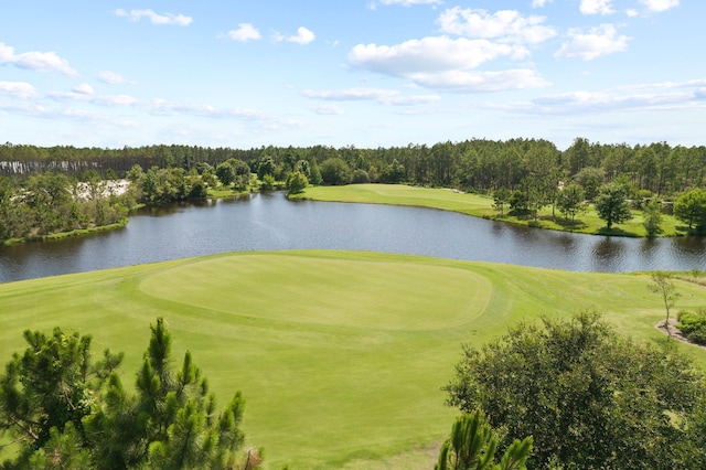 view of community with view of golf course and a water view