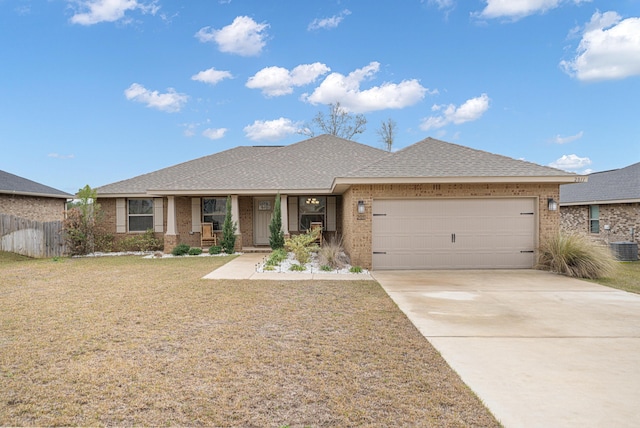 ranch-style house with a garage, concrete driveway, covered porch, a front lawn, and brick siding