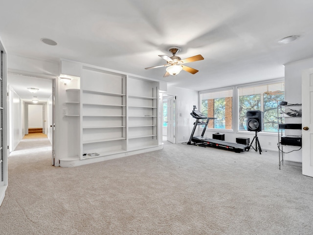 workout room featuring carpet flooring and a ceiling fan