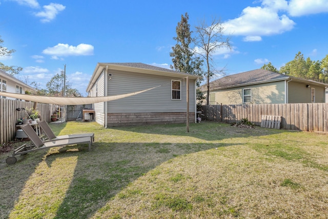 79 N 6th St, Santa Rosa Beach, FL 32459 - back of property featuring fence and a lawn