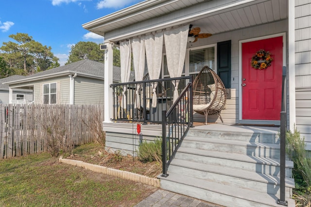 79 N 6th St, Santa Rosa Beach, FL 32459 - view of exterior entry with covered porch and fence
