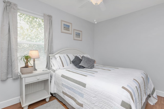 79 N 6th St, Santa Rosa Beach, FL 32459 - bedroom featuring ceiling fan, baseboards, and wood finished floors