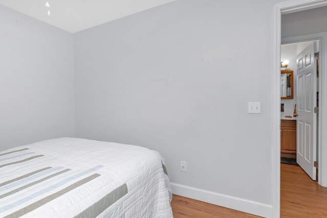 79 N 6th St, Santa Rosa Beach, FL 32459 - bedroom featuring light wood finished floors and baseboards