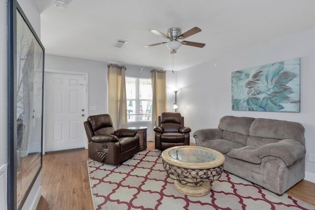 79 N 6th St, Santa Rosa Beach, FL 32459 - living room with light wood finished floors, visible vents, and a ceiling fan