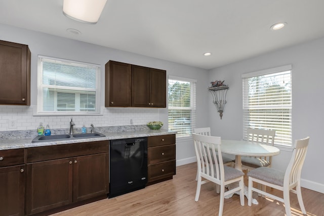 79 N 6th St, Santa Rosa Beach, FL 32459 - kitchen with dishwasher, light wood-style flooring, backsplash, dark brown cabinets, and a sink