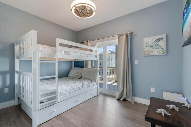 3625 Cape San Blas Rd, Cape San Blas, FL 32456 - bedroom featuring baseboards, wood finished floors, and access to exterior