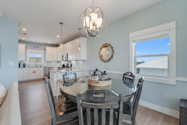 3625 Cape San Blas Rd, Cape San Blas, FL 32456 - dining space with baseboards, light wood finished floors, visible vents, an inviting chandelier, and recessed lighting