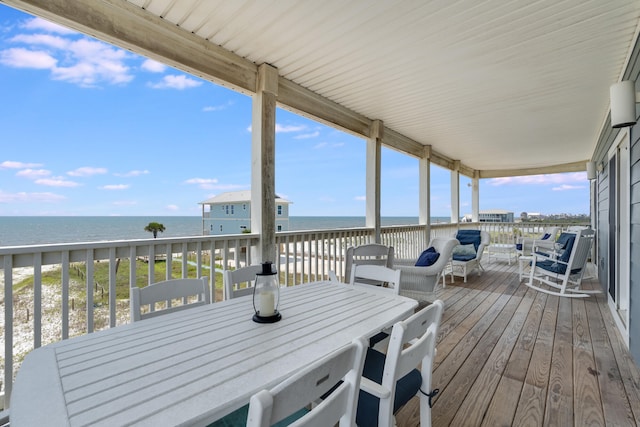 3625 Cape San Blas Rd, Cape San Blas, FL 32456 - wooden deck with a water view, outdoor dining space, and a beach view