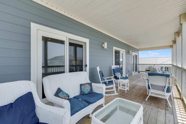 3625 Cape San Blas Rd, Cape San Blas, FL 32456 - wooden deck featuring an outdoor living space