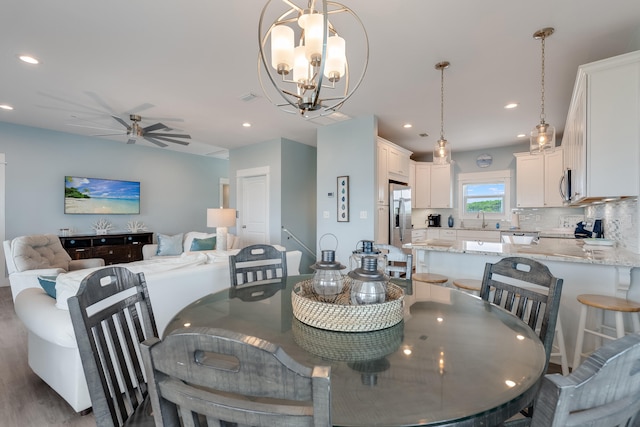 3625 Cape San Blas Rd, Cape San Blas, FL 32456 - dining room with recessed lighting, visible vents, and ceiling fan with notable chandelier
