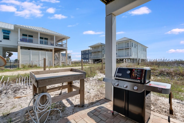 3625 Cape San Blas Rd, Cape San Blas, FL 32456 - view of patio / terrace featuring a grill and fence