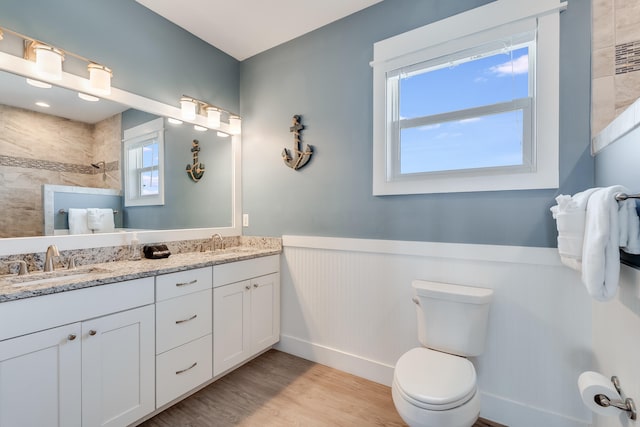 3625 Cape San Blas Rd, Cape San Blas, FL 32456 - full bath with wood finished floors, a wainscoted wall, a sink, walk in shower, and toilet