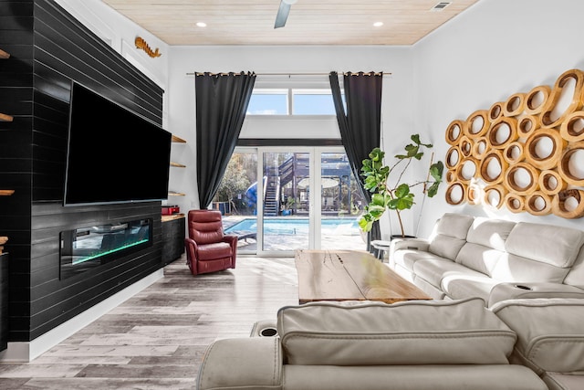 living room with wooden ceiling, a ceiling fan, wood finished floors, and recessed lighting