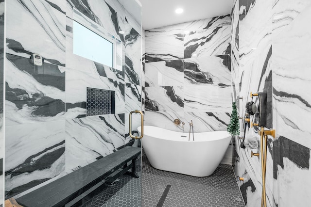 full bathroom featuring tile patterned flooring and a freestanding bath