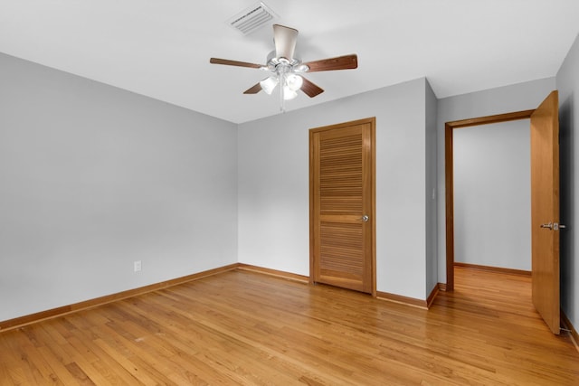 unfurnished bedroom with visible vents, baseboards, light wood-style floors, and a closet