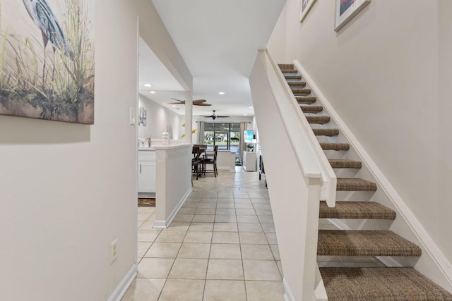 stairs with ceiling fan, baseboards, tile patterned flooring, and recessed lighting