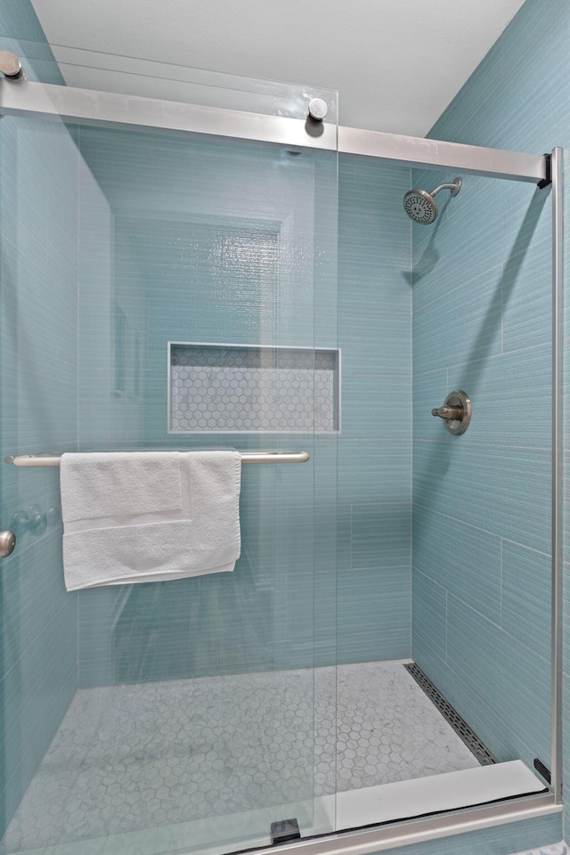 bathroom with a shower stall