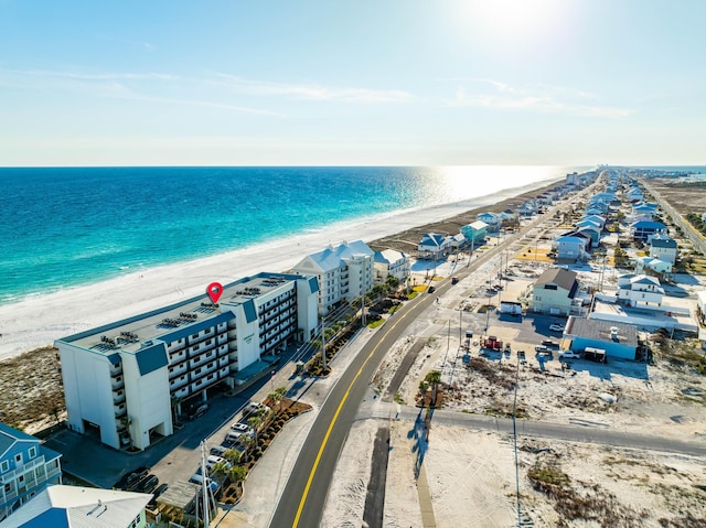 aerial view with a water view and a view of the beach