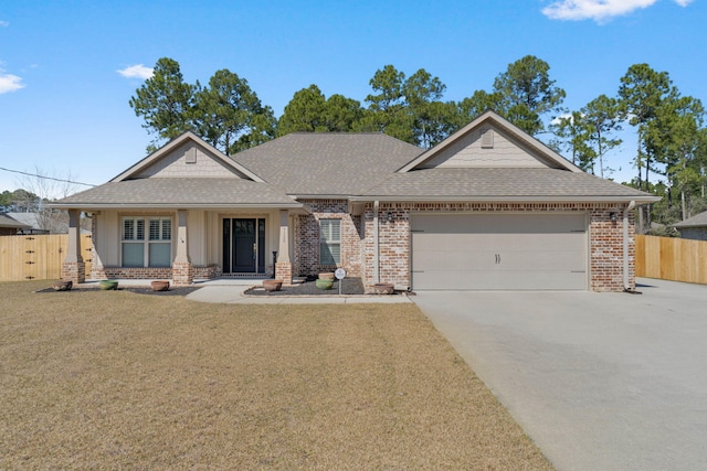 view of front of home featuring a shingled roof, concrete driveway, an attached garage, fence, and brick siding