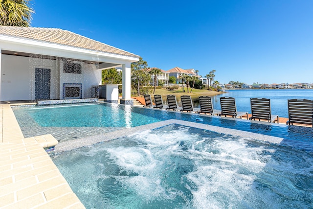 view of pool featuring an in ground hot tub, exterior fireplace, and a water view