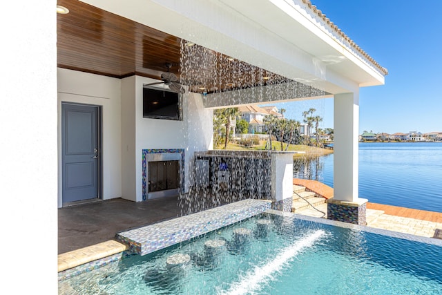 view of swimming pool with a patio area and ceiling fan