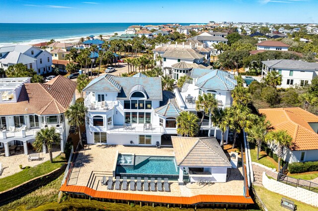 drone / aerial view with a water view and a residential view