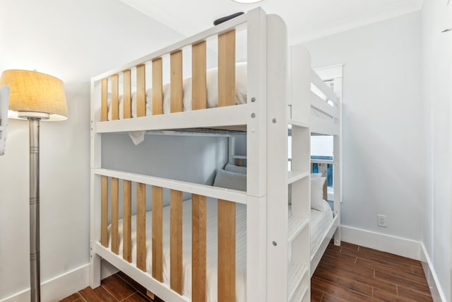 stairs featuring wood tiled floor and baseboards