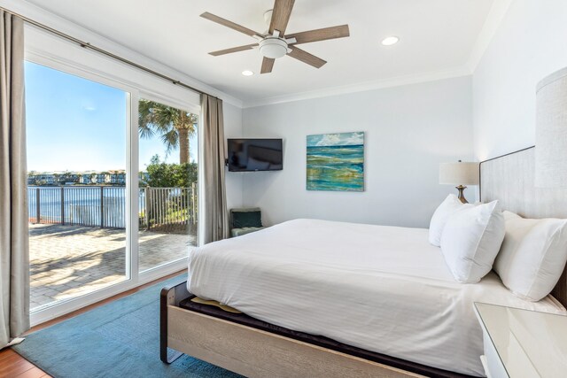 bedroom featuring access to exterior, ornamental molding, wood finished floors, and recessed lighting