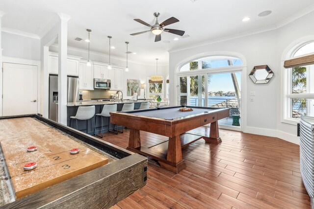 playroom featuring baseboards, billiards, ornamental molding, and wood finished floors