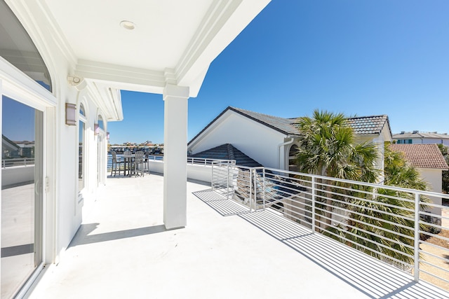 view of patio featuring a balcony