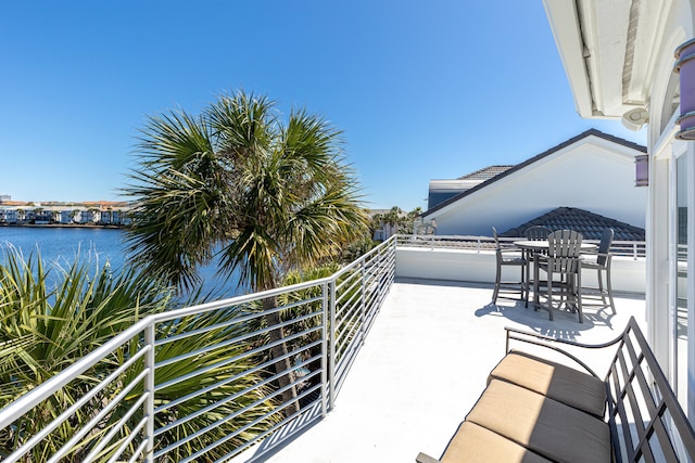 balcony featuring a water view