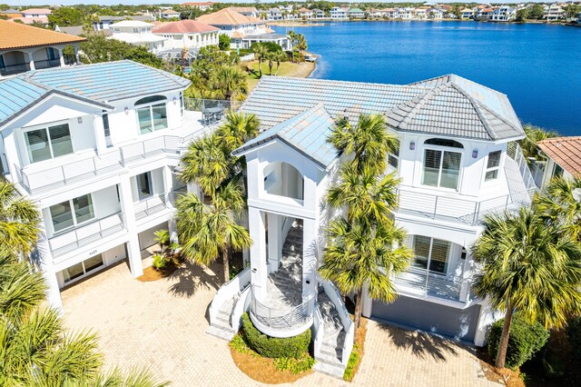 aerial view featuring a water view and a residential view