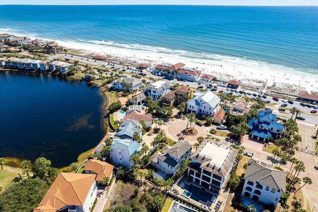 bird's eye view featuring a residential view, a water view, and a beach view