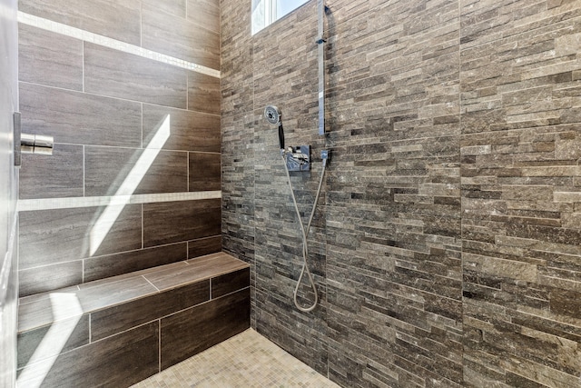 full bath featuring tiled shower