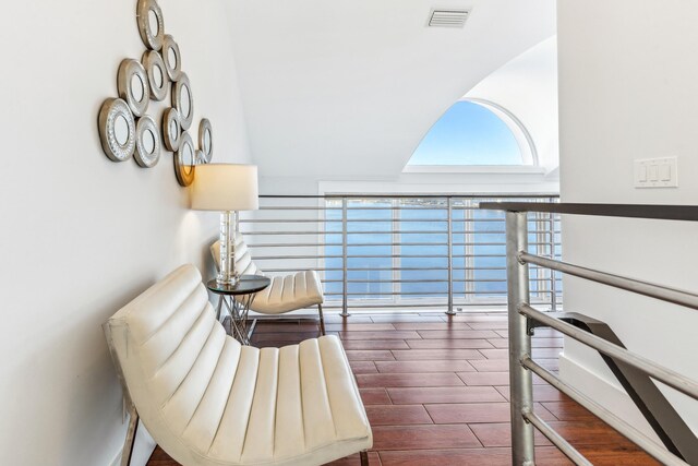 sitting room with visible vents and wood finished floors